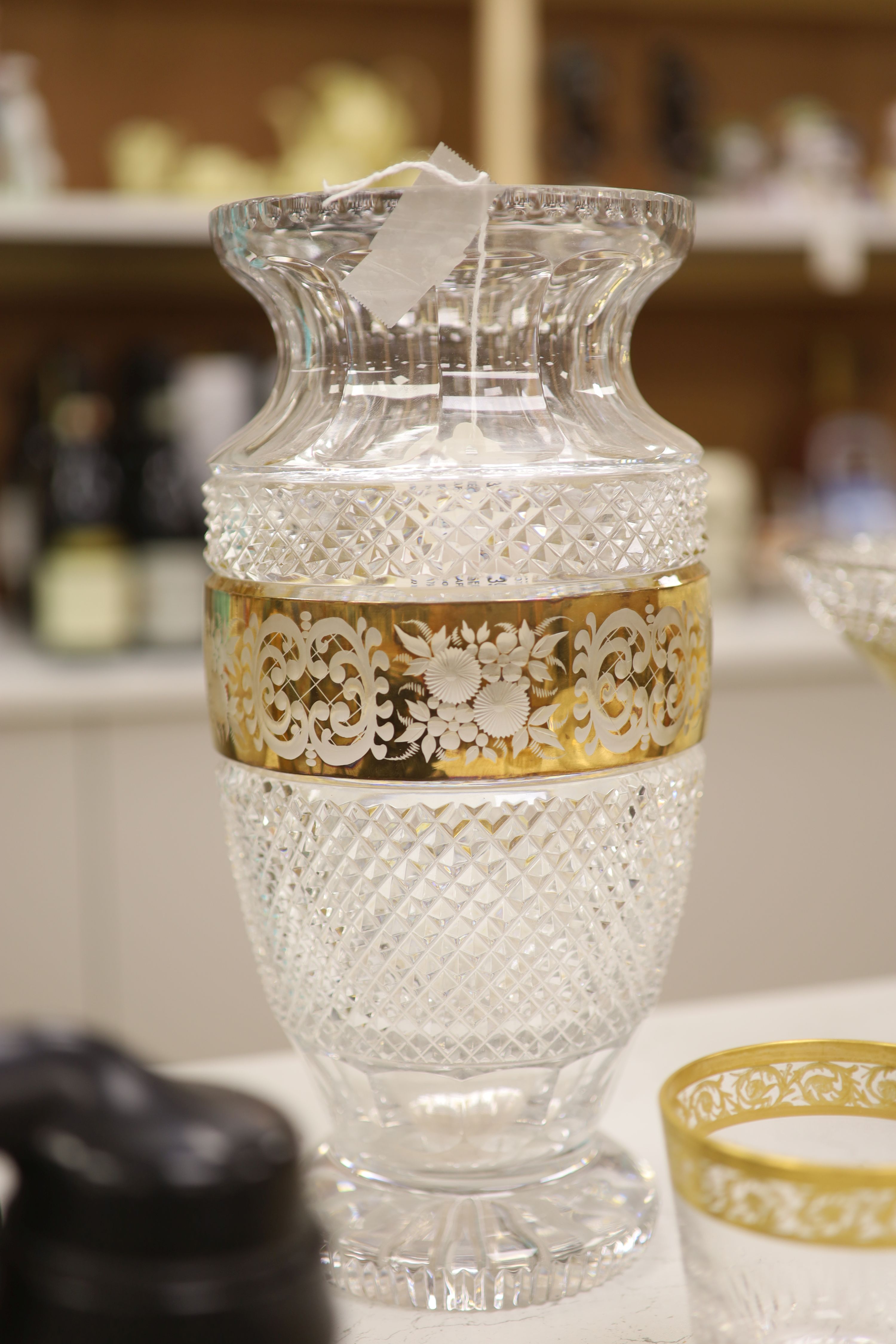 A Moser style tall tapered cut glass vase heightened in gilt, a similar circular bowl, a pedestal bowl and two St Louis tumblers